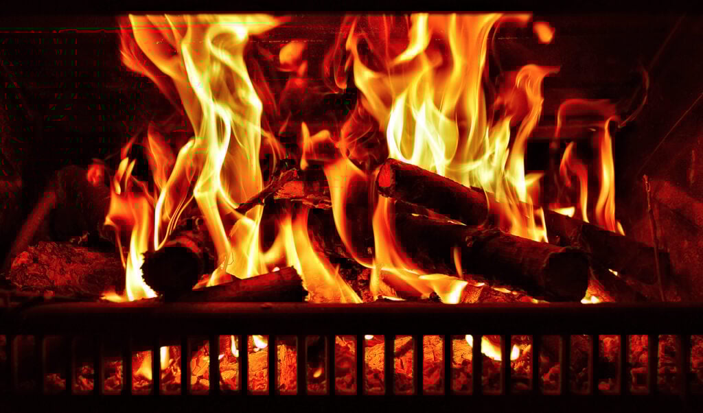 Logs on fire in a fireplace