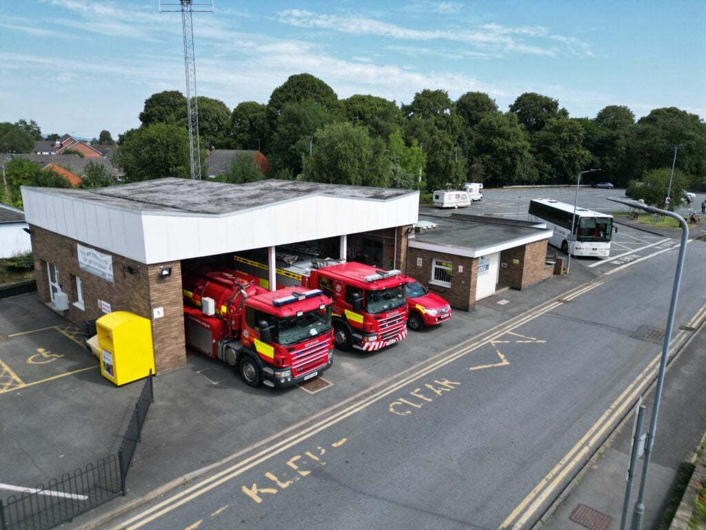 Fire station with three fire vehicles taken from above