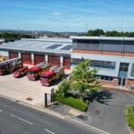 Drone image of fire station with fire vehicles