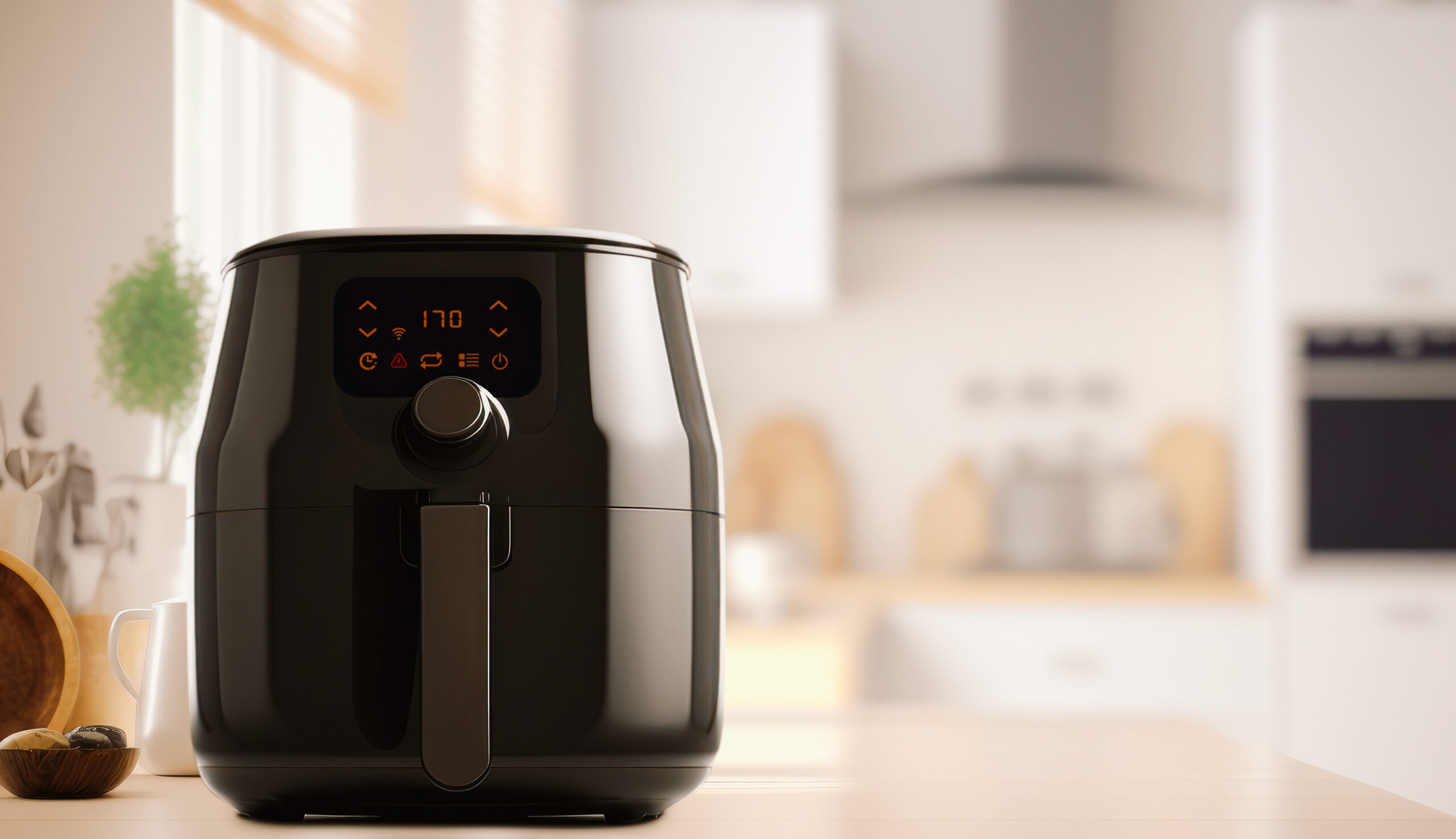 Air fryer machine in kitchen. Lifestyle of new normal cooking.