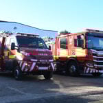 Fire engine and compact fire engine in front of fire station picture taken from road